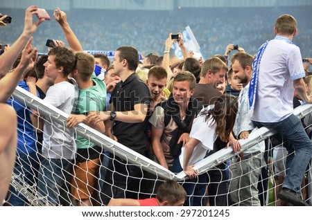 KIEV, UKRAINE - JUN 4: Rampant Fans on the field Broken Gate after the final match of the Cup of Ukraine between Shakhtar vs Dynamo Kiev, 4 June 2015, NSC Olympic Stadium, Kiev, Ukraine