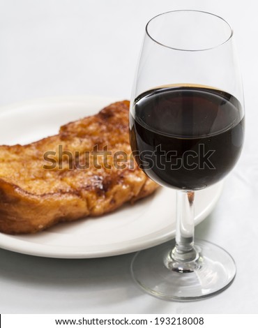 Torrijas are the spanish version of French Toast. Slices of Bread soaked in milk, egg-coated and fried. Typical dessert in Easter Season served with porto wine or sweet sherry