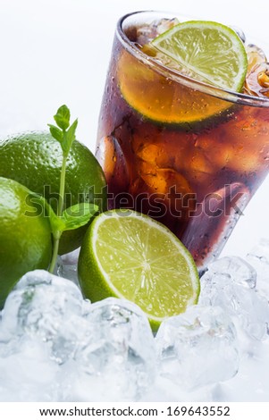 Fresh Fresh cocktail with cola drink and lime fruit