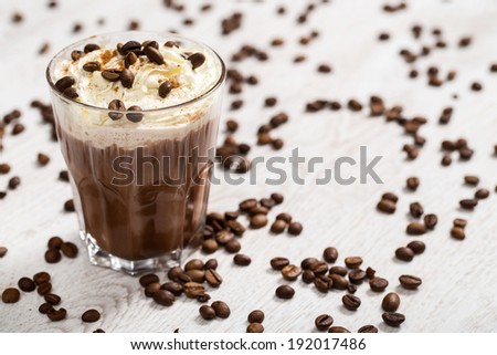 Delicious coffee cocktail with cream foam
