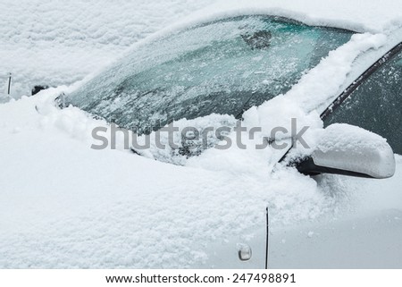 Close up of car covered with snow