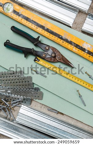 Different instruments and materials for build a plasterboard walls