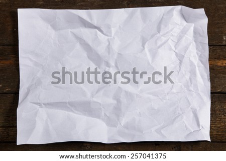 Old and crumpled sheet of paper
