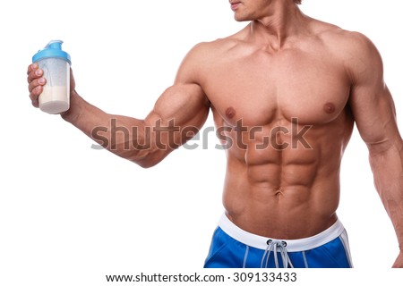 Muscular man with protein drink in shaker over white background