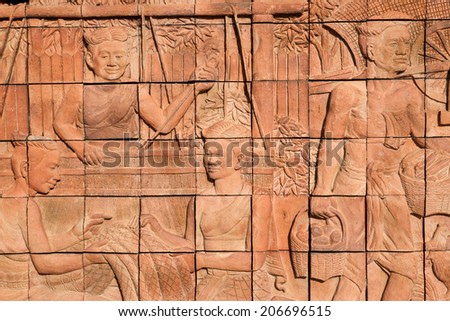 Temple wall was produced from brick with life story of Thai culture, Thailand.