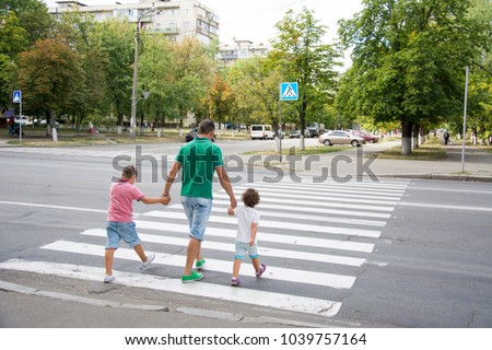 Similar – Image, Stock Photo Mother and son crossing a bridge together