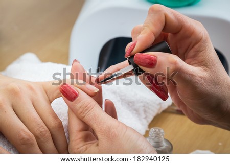 Manicure treatment in cosmetic salon