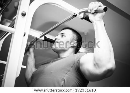 man with weight training equipment on sport gym club