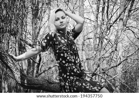 blond in the forest black and white