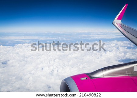 Earth from the height of the aircraft. Earth, clouds, sky with airplane window. Engine airplane. Aircraft, turbine, earth, sky, clouds, mountain, plane - concept of air travel. Article about planes.