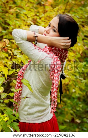 Young woman portrait in autumn park.Young woman in beautiful autumn park, concept autumn.Autumn woman on leafs background