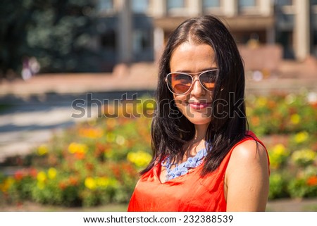 Young girl on the street. Brunette travels the most beautiful European, ancient city. Beautiful  background. Travel, old city - Travel Concept.
