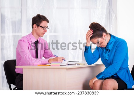 Young businesswoman at the hiring interview in the office.A woman manager looking at interview during conversation.Job interview.Job applicant having an interview