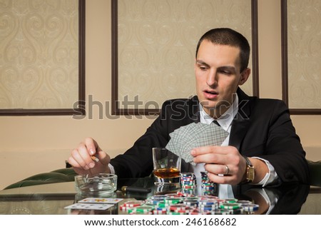 Poker player in the casino at the gaming table