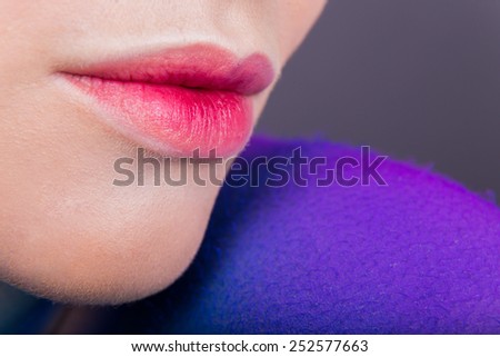 Professionally lip make-up. Scarlet beautiful lips. Beautifully painted lips model. Beautiful female lips.