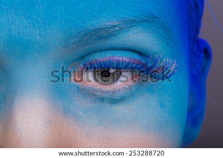 Eye Makeup. Creative eye makeup. False eyelashes. Blue shadows on the eyes. Beautiful eyeliner.