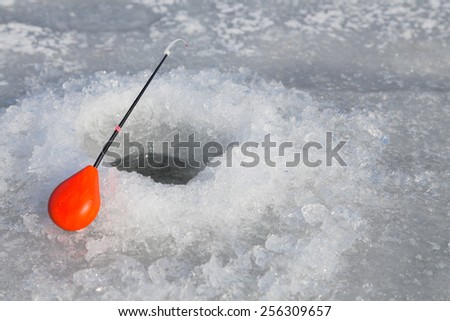 Winter ice fishing. Fishing rod for ice fishing. Hobbies, winter fishing.