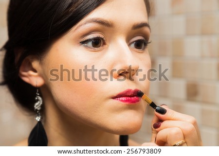Makeup. Eyebrow Makeup. Eyes. Lips make-up. Beautiful woman doing makeup.