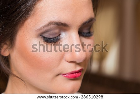 Beautiful girl. Beauty Photo. Girl with a chic makeup. Red lips, expressive eyes. Work up artist.