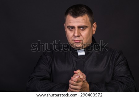 The priest. An actor dressed as a Catholic priest. Theatrical productions. Professional stage Grimm. Art, theater, Grimm. Makeup.