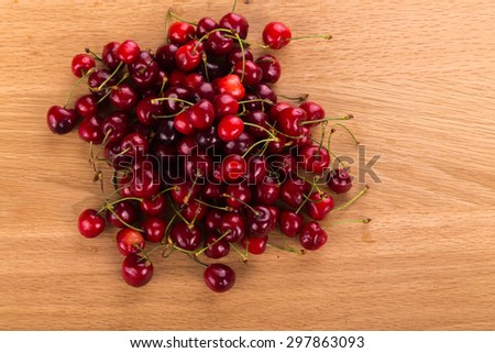 Red cherries. Cherry as background / full frame. fresh cherries on a wooden table