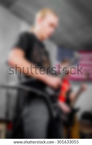 Rock musicians playing in the band. Musicians, art, music. Blurred background, abstract background. blurred picture
