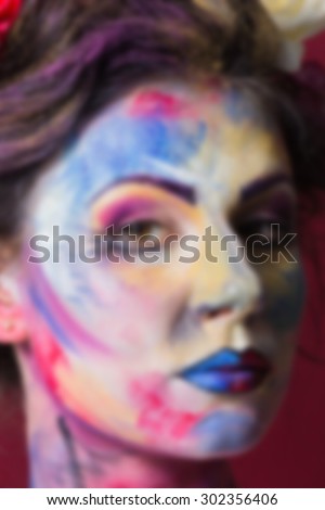 Beautiful, bright creative make-up. blurred Background