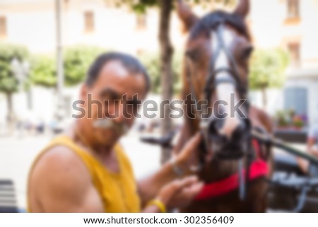 The carriage horses in a picturesque street. blurred Background