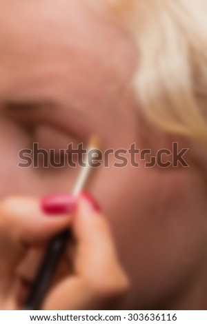 Work stylist and makeup artist. blurred Background