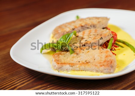 Delicious, wholesome food. Chops with vegetables. Pork chops on a plate with vegetables.