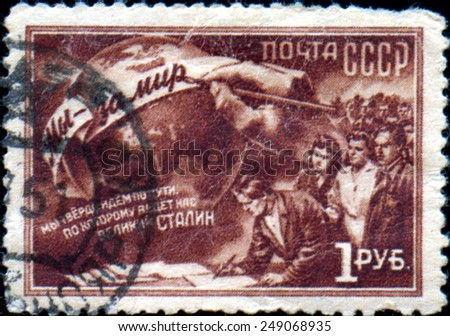 The USSR - CIRCA 1950: the press printed in the USSR shows the image of the workers reading the text of the slogan of Stalin, circa 1950.