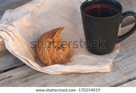rye bread and tea, paper bag on the wood boards