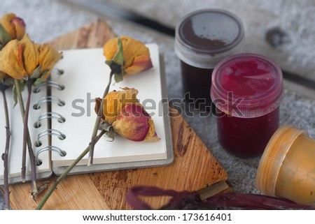 notebook, dry rose, paint on the wood board