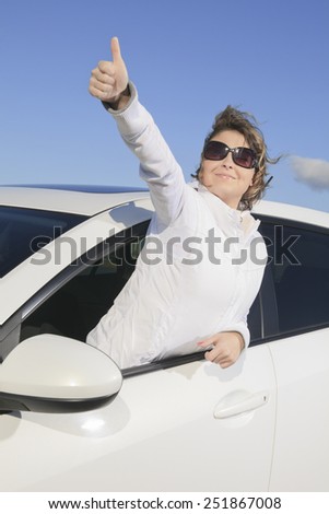 Car. Woman driver happy smiling