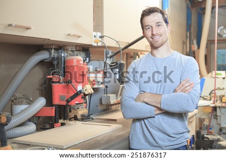 A carpenter working hard at the worksop