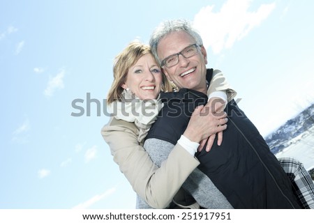 Portrait of happy senior couple in winter season
