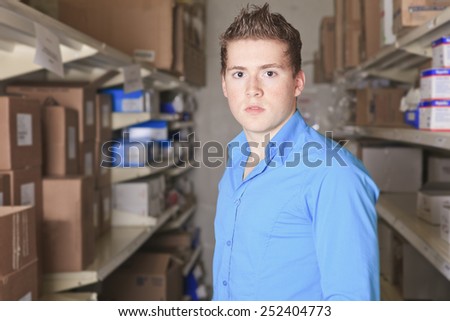 A Pretty warehouse manager checking the inventory