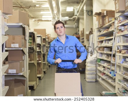 A Pretty warehouse manager checking the inventory