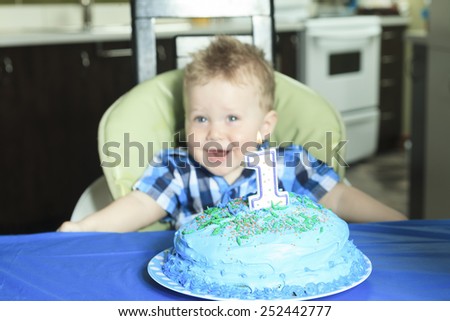 A One Year Old Boy Cake with big smile.