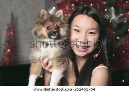 A Girl with dog inside his house