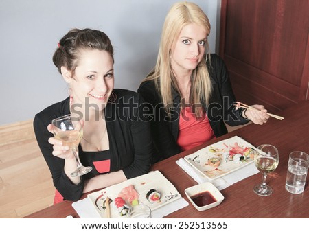 A social girl in a sushi restaurant