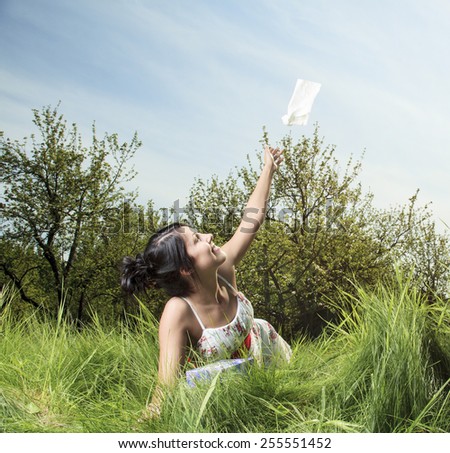 Woman sending handkerchief on the air