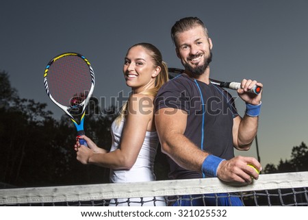 Two Happy Tennis Players having fun to play