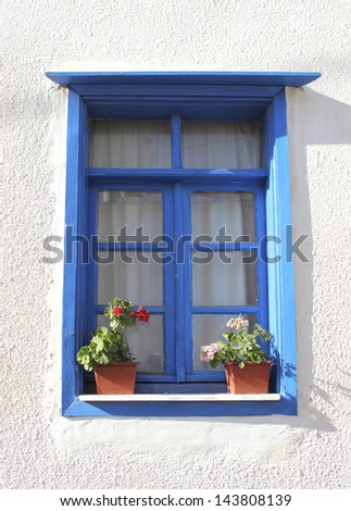Village house\'s  window with flower pots, Turkey