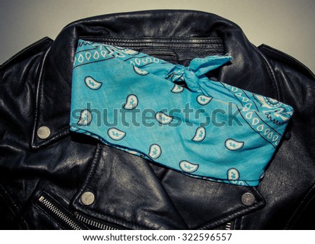 biker black leather jacket and blue bandana. Photo with vintage toning and vignette