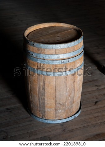 Old brown wooden barrel on a wooden floor