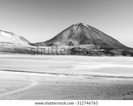 Laguna Verde with high volcano Licancabur on a background, Bolivia, black and white image
