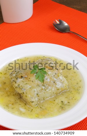 Cod fillet in a green sauce