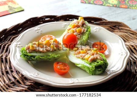 Romaine lettuce hearts salad with tuna, corn and cherry tomatoes