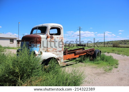 SELIGMAN, ARIZONA - AUGUST 16, 2014: Old rusty truck abandoned on Mother Road, on August 16, 2014 in Seligman, AZ. Seligman is famous as origin of Route 66 and inspiration for the town of movie Cars.